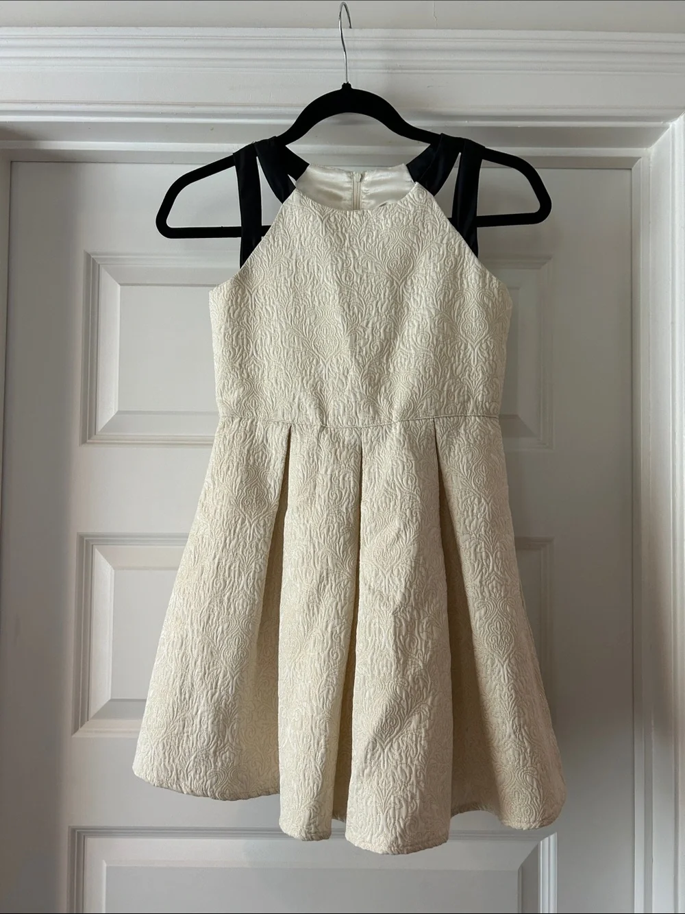 Girls' Cream jacquard fit and flare w/ Black straps, fully lined. Size 10